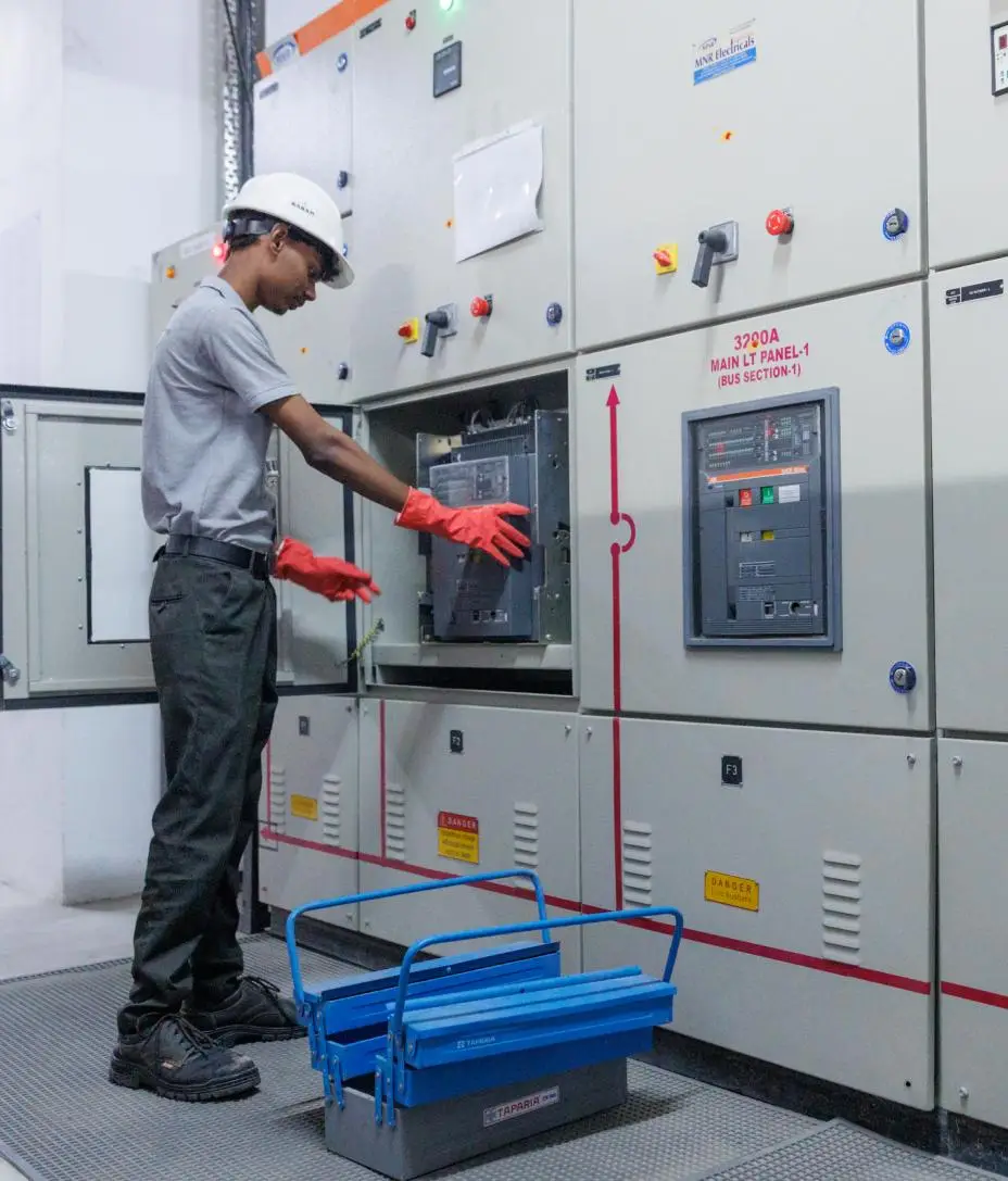 electrician-operating-electrical-control-panel